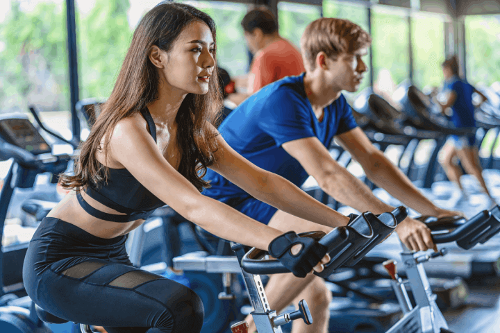 couple-young-working-out-in-gym-fitness